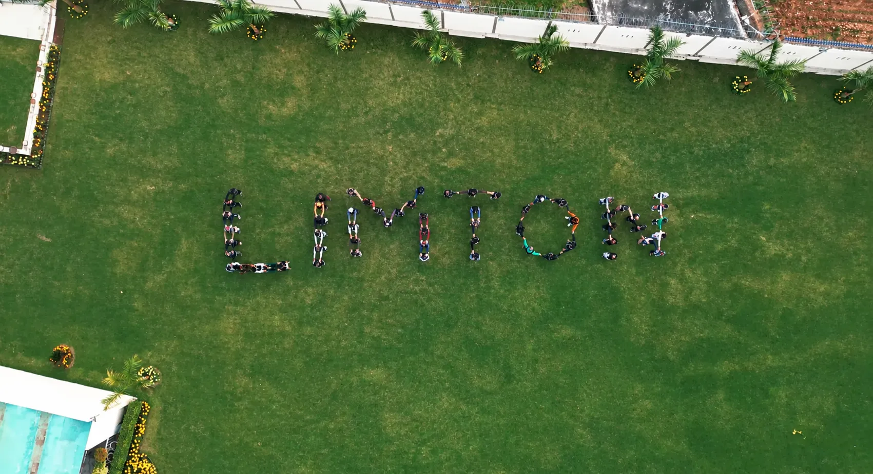 Limton team forming the company name on the factory lawn